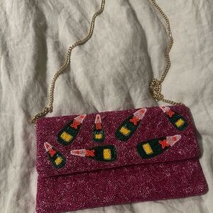 Vibrant Pink Beaded Clutch with Champagne Motif